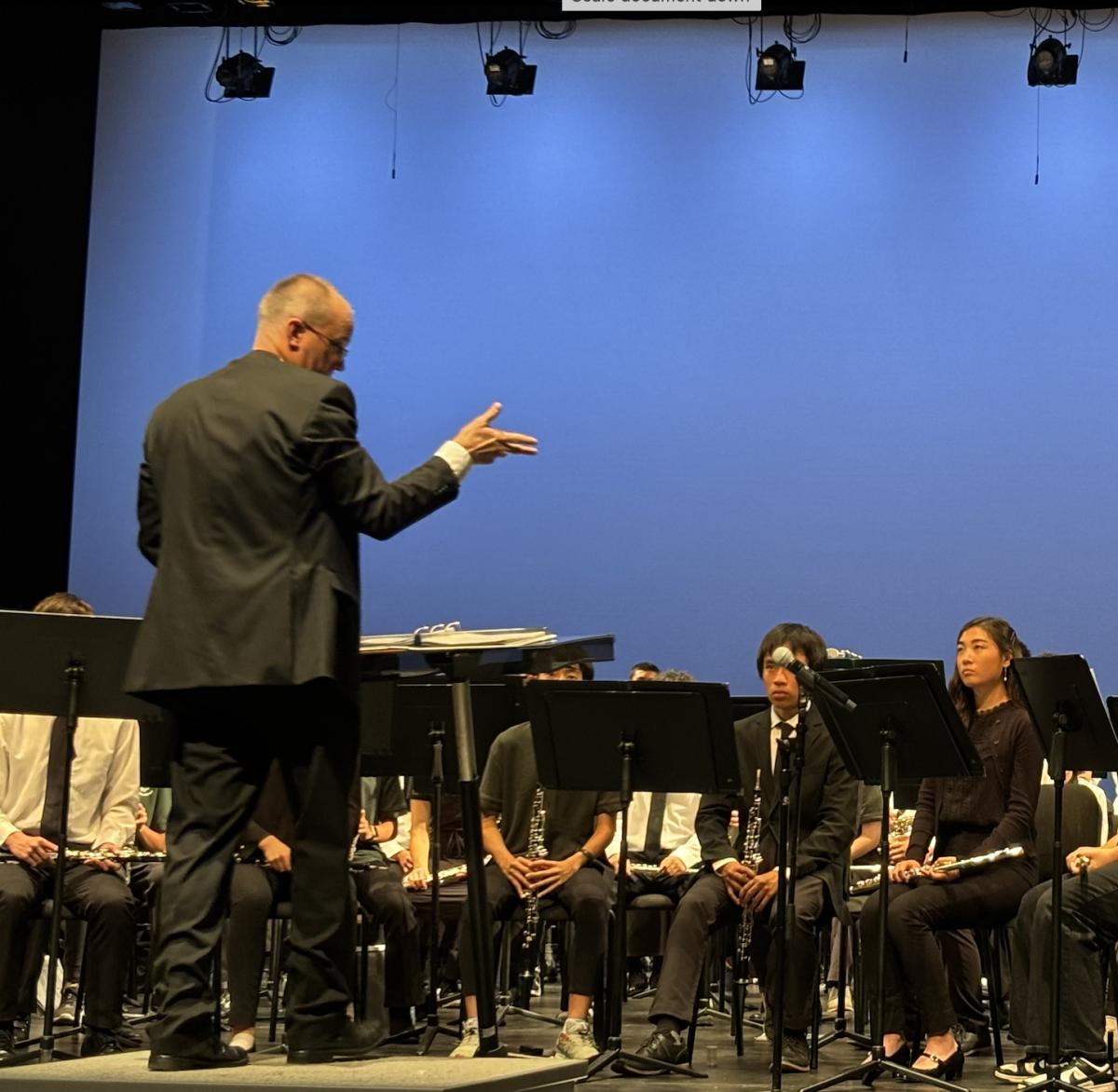 Director Jeff Willner orchestrates all the Palo Alto High School and Greene Middle School bands performed on Nov. 21 in the Palo Alto High Schools Performing Arts Center. The Paly Greene concert has been going on for almost 30 years according to Willner. "We want all of you green shirts (Greene Middle school band students) to be up here next year," Willner said